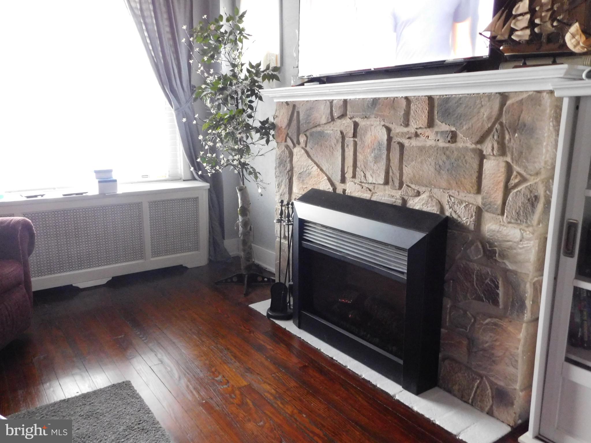 964 New Holland Road Reading, PA 19607 - Photo 9 of 59 Cozy living space with a stone fireplace.