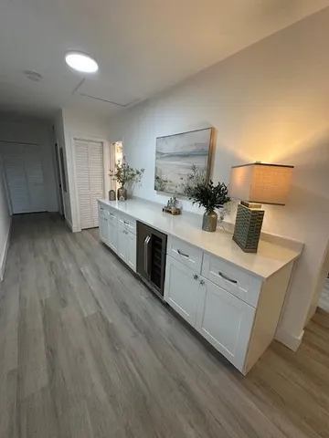 a bathroom with a double vanity sink toilet and a tub
