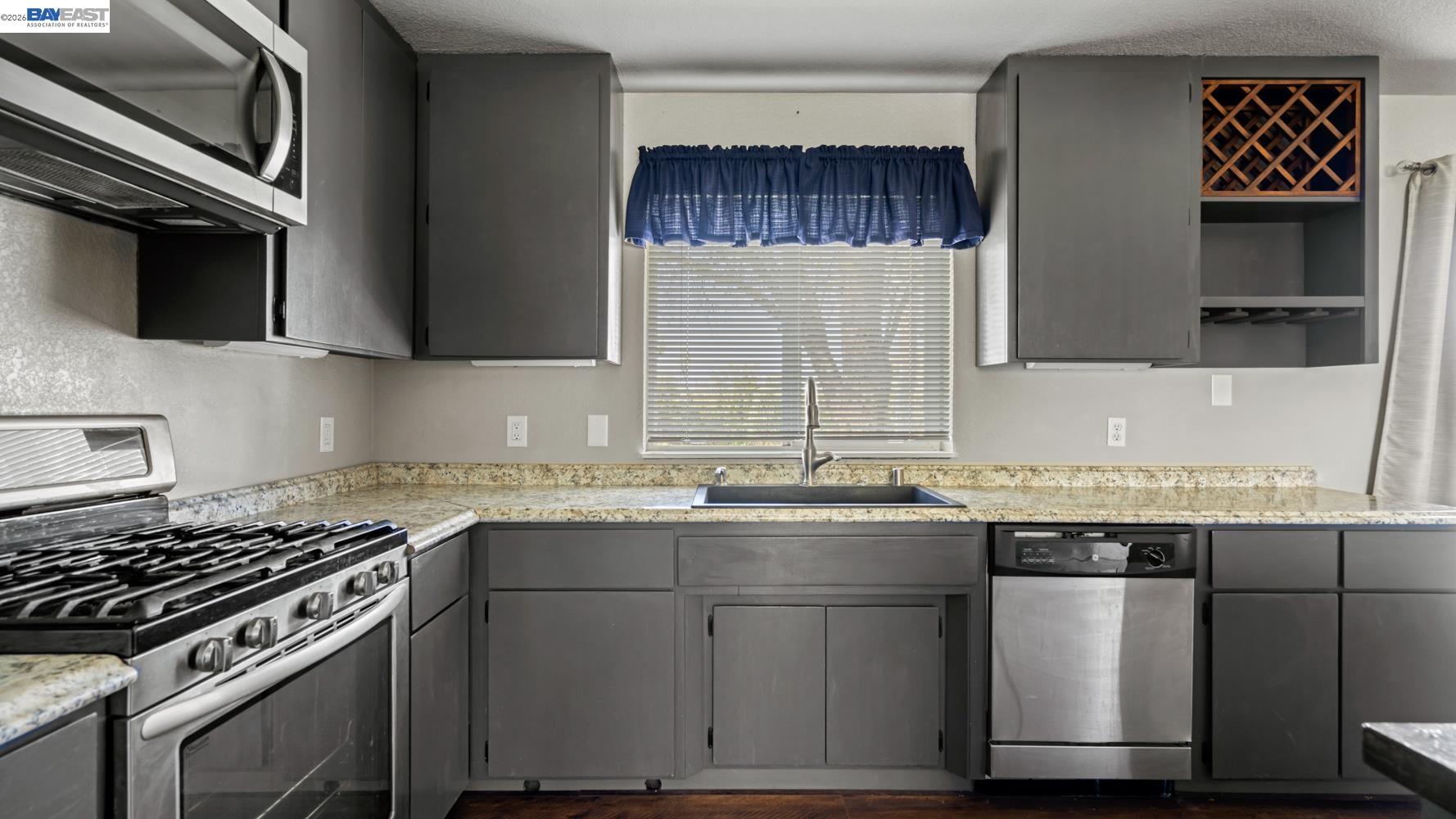 3710 Lakeview Drive Shingle Springs, CA 95682 - Photo 13 of 49 a kitchen with a sink stove and cabinets