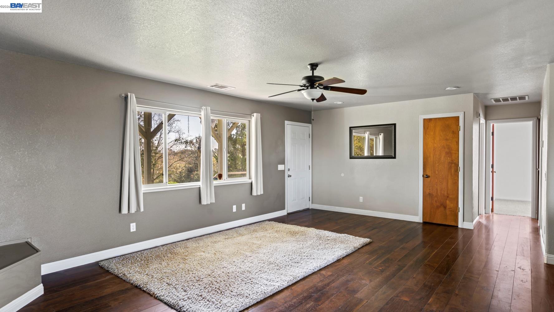 3710 Lakeview Drive Shingle Springs, CA 95682 - Photo 6 of 49 a view of an empty room with a window and wooden floor