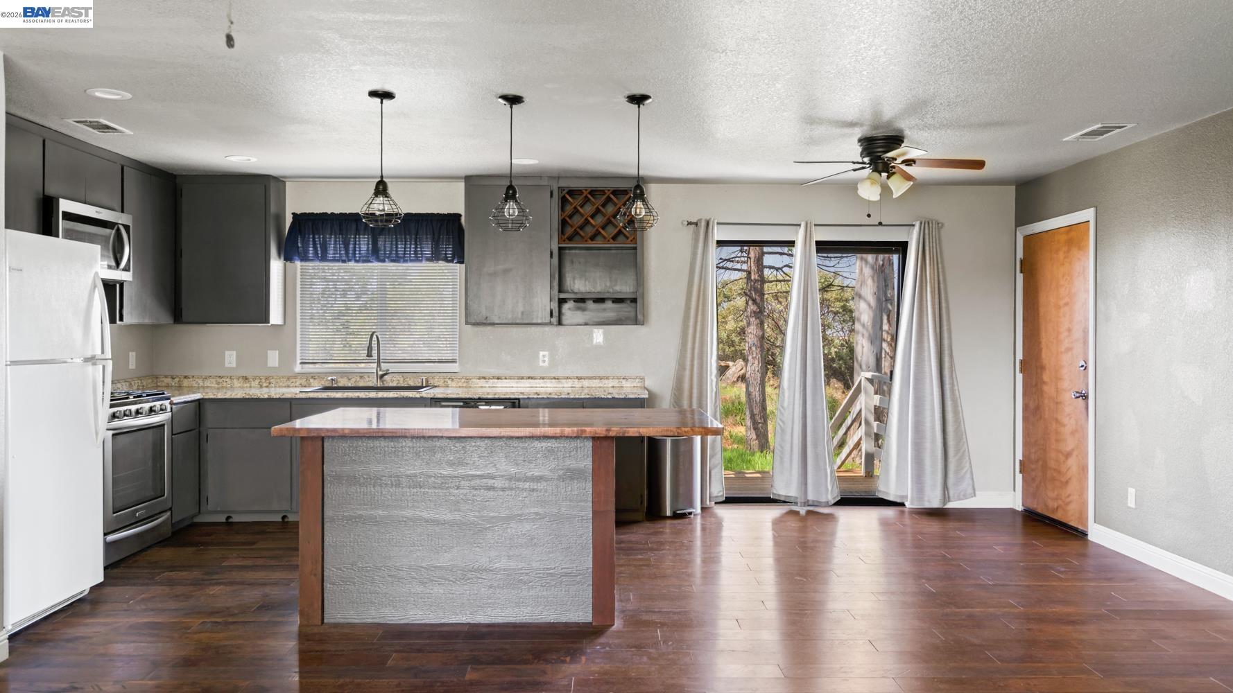 3710 Lakeview Drive Shingle Springs, CA 95682 - Photo 9 of 49 a kitchen with stainless steel appliances granite countertop a refrigerator a oven and a stove with wooden floors