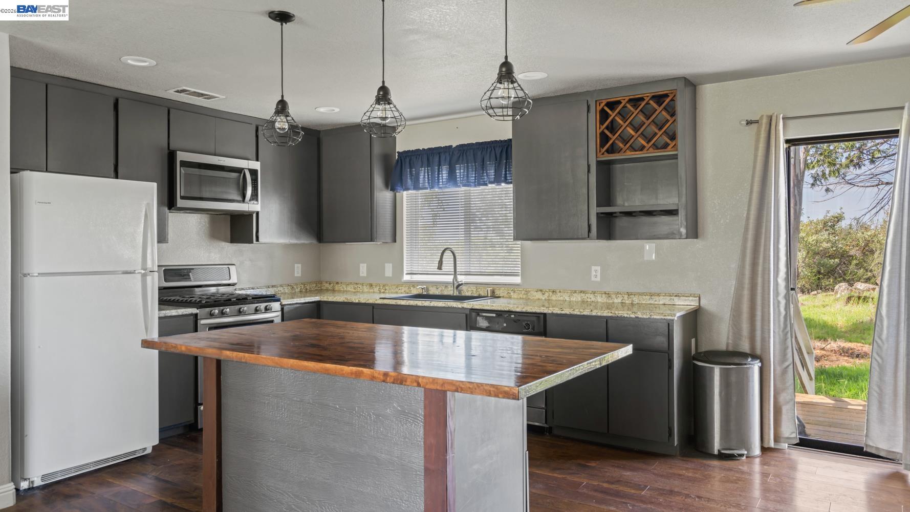 3710 Lakeview Drive Shingle Springs, CA 95682 - Photo 10 of 49 a kitchen with stainless steel appliances granite countertop a sink stove and refrigerator