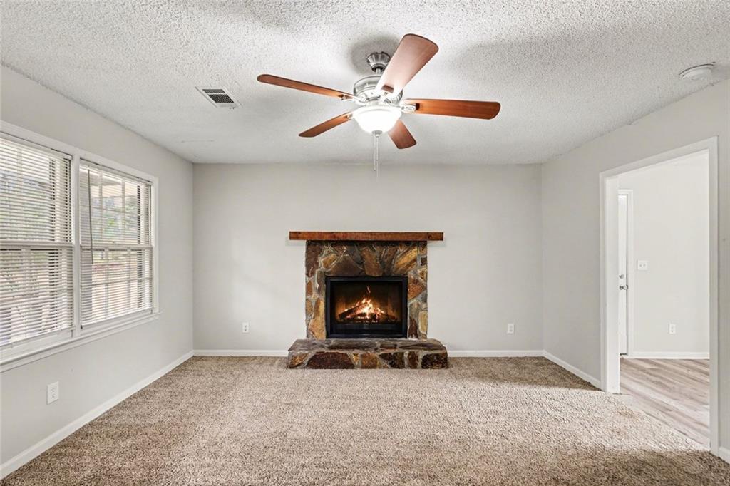 4500 Nebo Road Hiram, GA 30141 - Photo 2 of 15 a living room with furniture and a fireplace