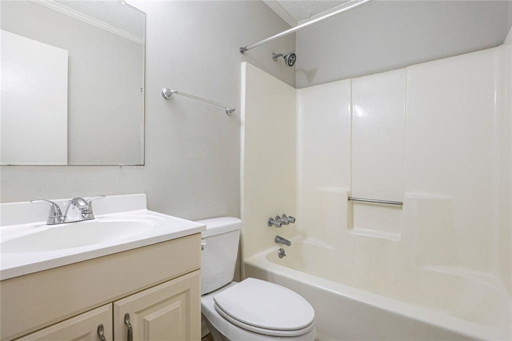 4500 Nebo Road Hiram, GA 30141 - Photo 9 of 15 a bathroom with a sink toilet vanity and shower