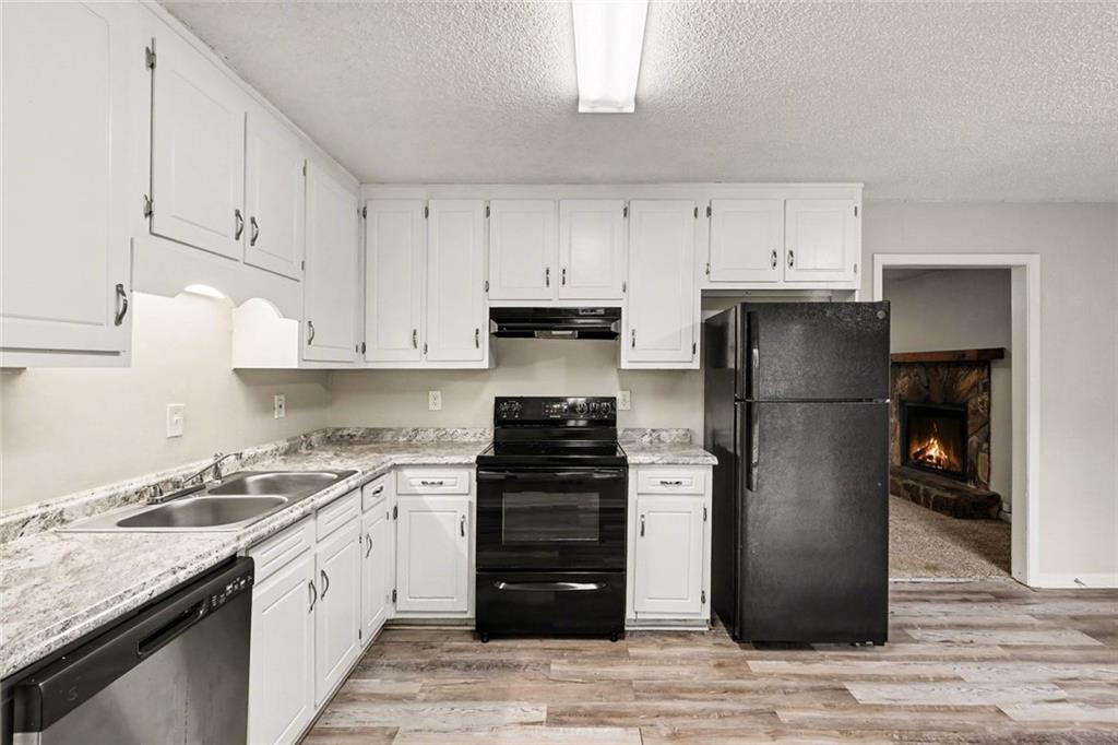 4500 Nebo Road Hiram, GA 30141 - Photo 10 of 15 a kitchen with a refrigerator sink and cabinets