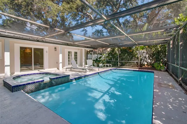 a view of a backyard with sitting area