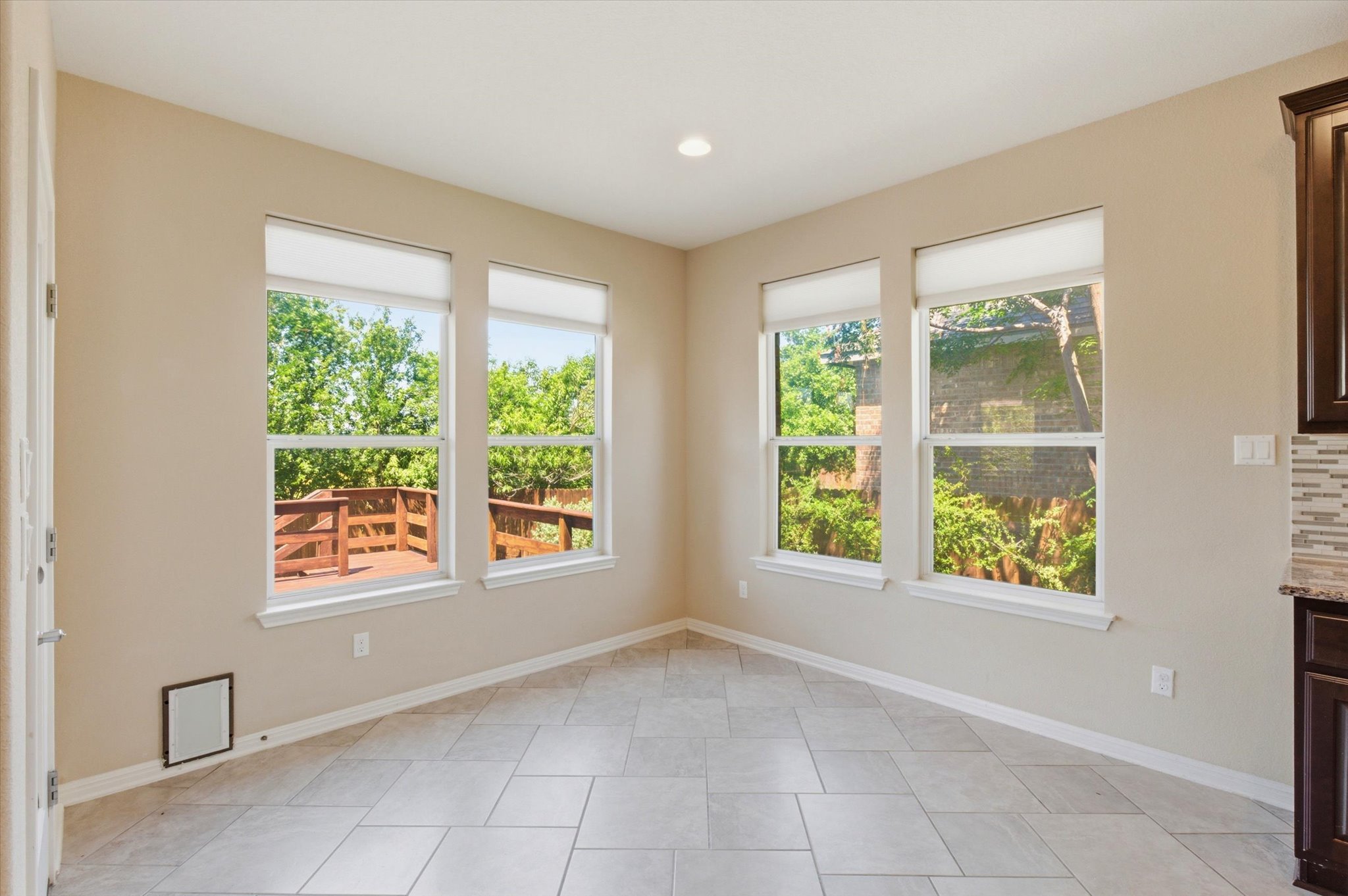 1511 Rimstone Drive Cedar Park, TX 78613 - Photo 16 of 39 A well-lit corner with ample natural light offers views of the surrounding outdoor deck and greenery.