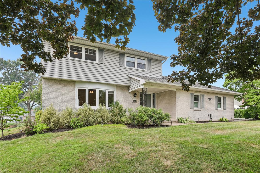 3659 Ironstone Road Bethlehem, PA 18020 - Photo 40 of 52 A classic brick and siding home presents a welcoming facade with well-maintained landscaping and mature trees.