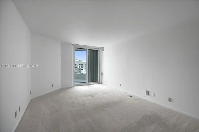a bathroom with a granite countertop sink mirror and shower