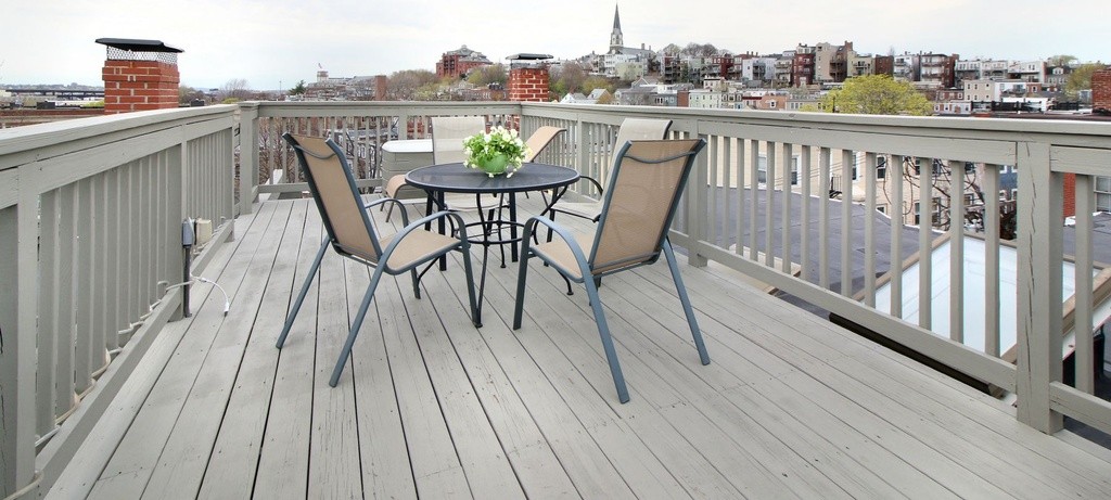 a view of roof deck patio and outdoor seating