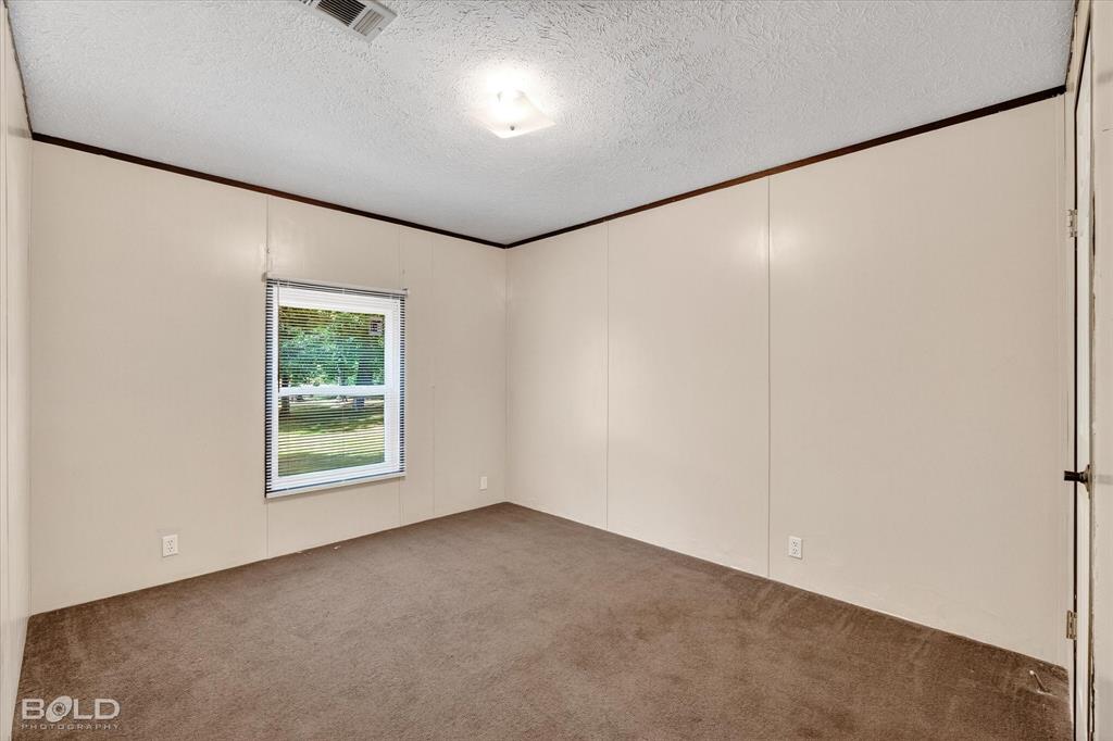 2153 Highway 2 Plain Dealing, LA 71064 - Photo 32 of 39 an empty room with a window