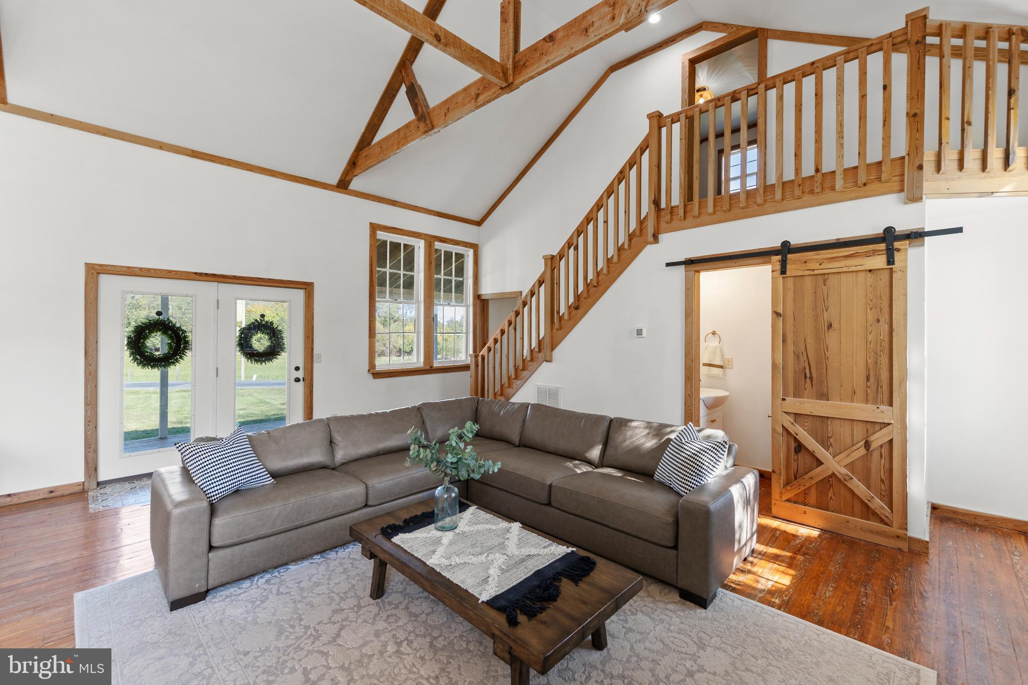 571 Rest Church Road Winchester, VA 22603 - Photo 13 of 45 a living room with furniture and wooden floor