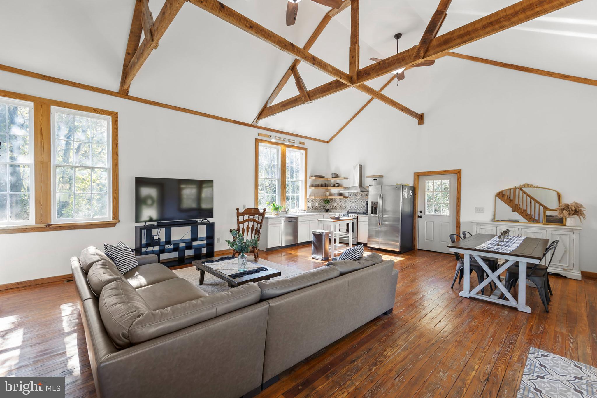 571 Rest Church Road Winchester, VA 22603 - Photo 15 of 45 a living room with furniture and a flat screen tv