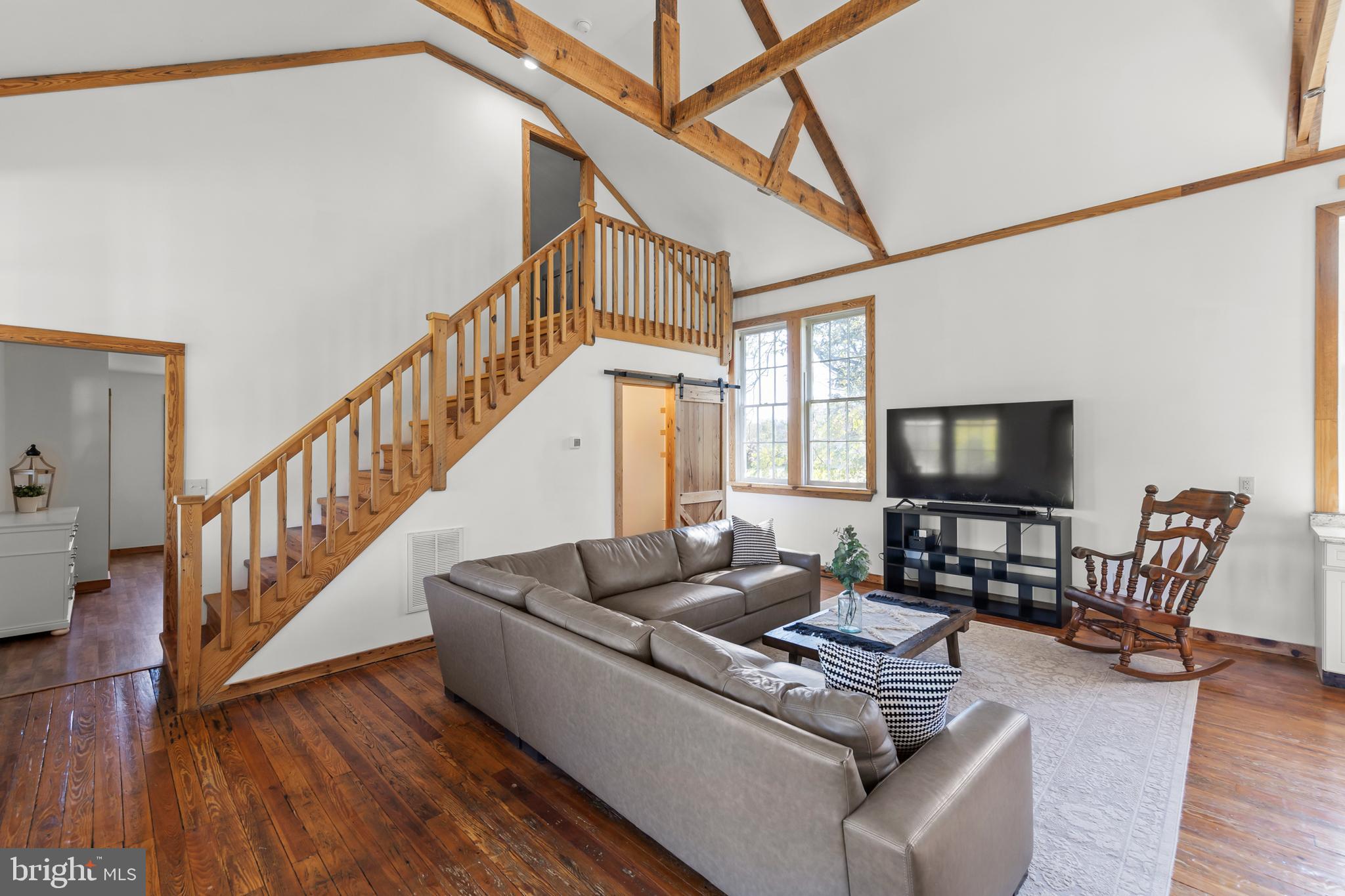 571 Rest Church Road Winchester, VA 22603 - Photo 16 of 45 a living room with furniture and a flat screen tv