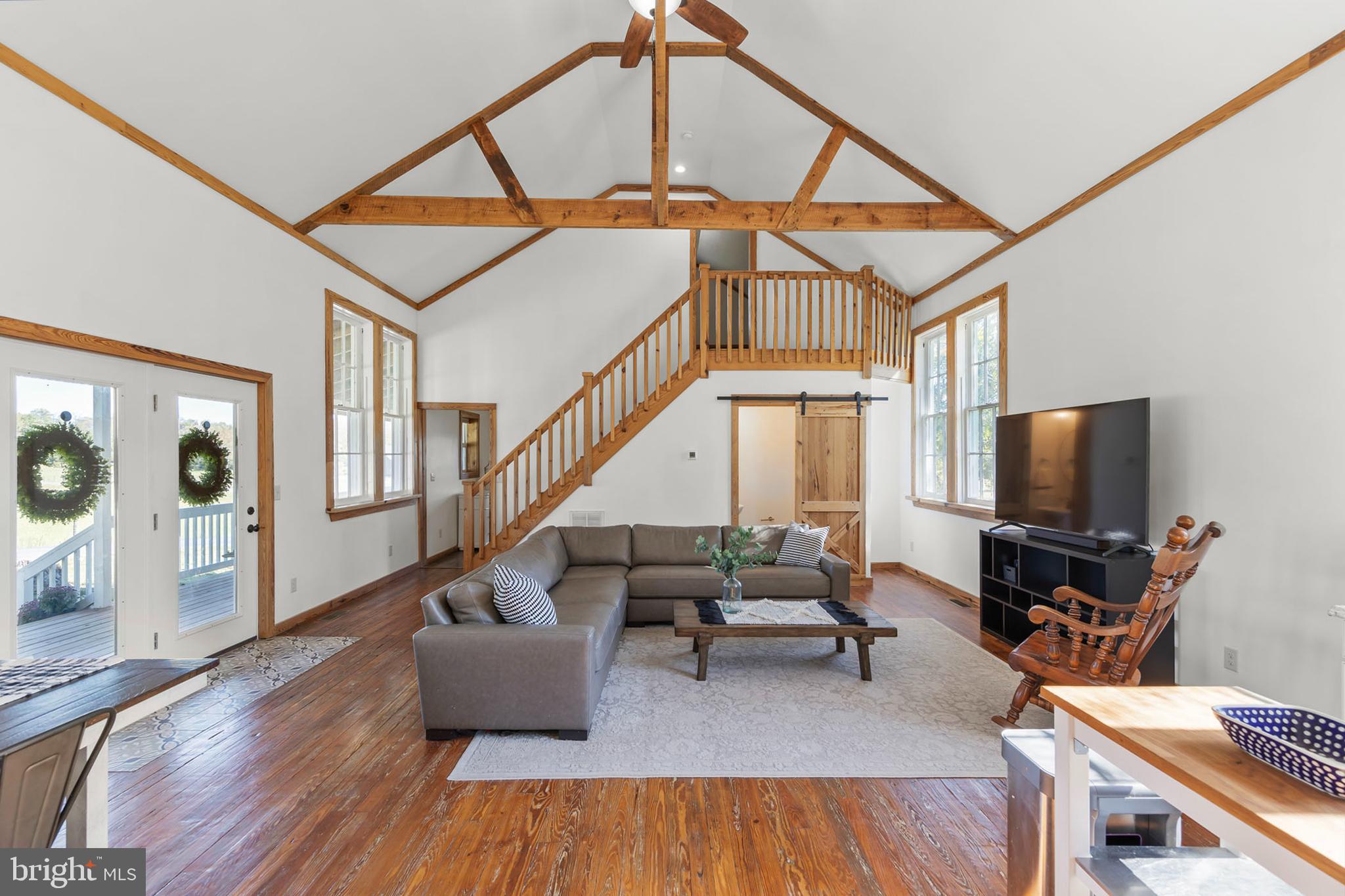 571 Rest Church Road Winchester, VA 22603 - Photo 17 of 45 a living room with furniture and a flat screen tv