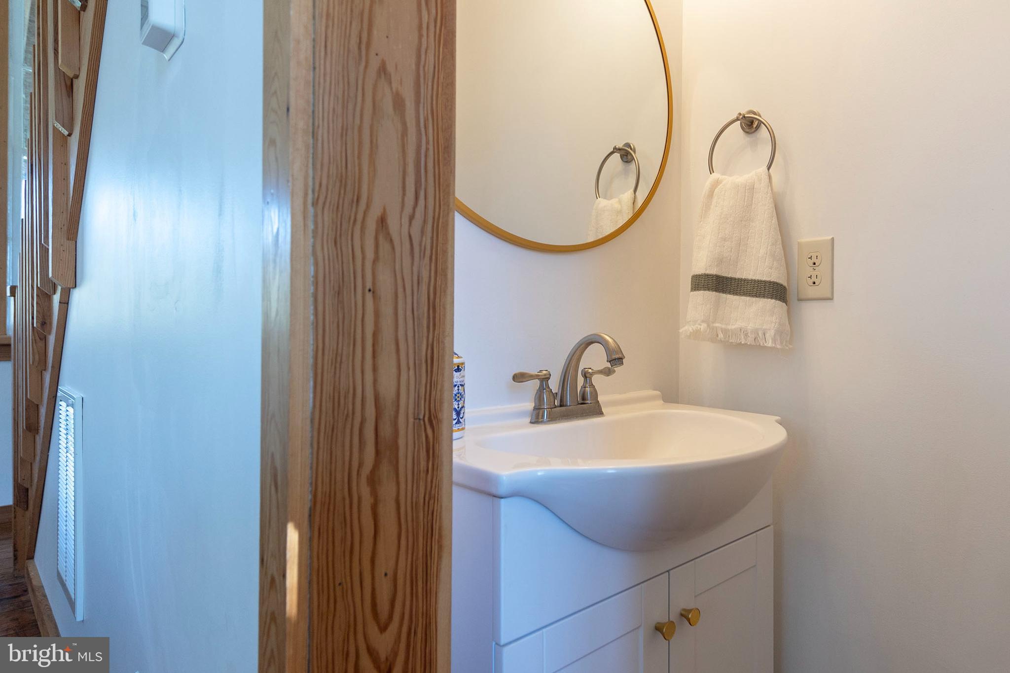 571 Rest Church Road Winchester, VA 22603 - Photo 19 of 45 a bathroom with a sink and a mirror