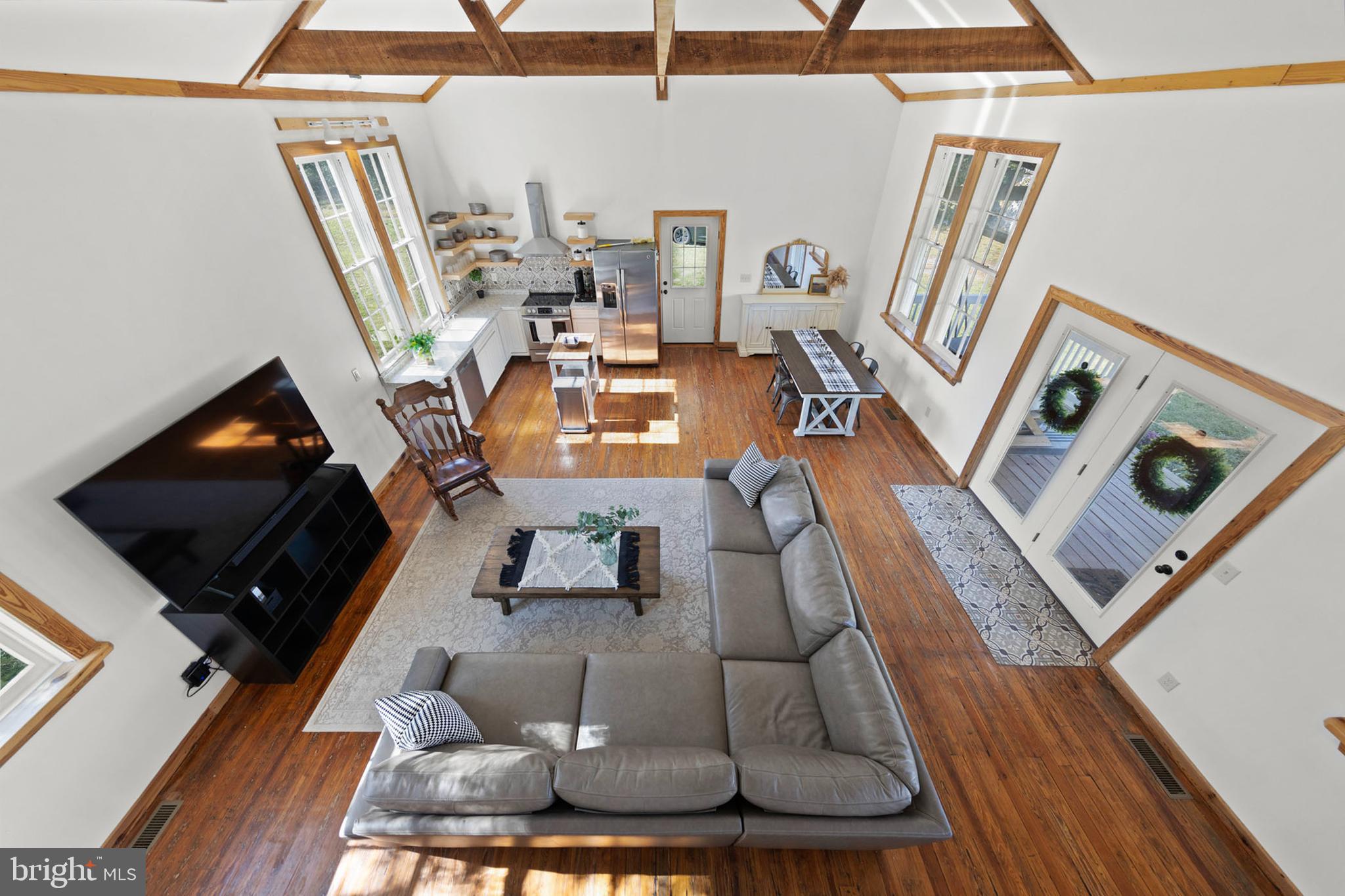 571 Rest Church Road Winchester, VA 22603 - Photo 24 of 45 a living room with furniture and a flat screen tv