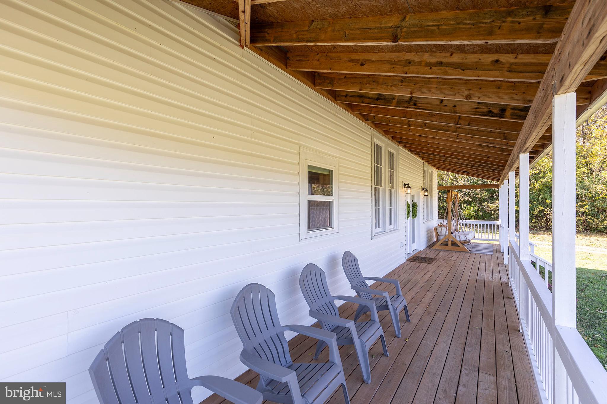 571 Rest Church Road Winchester, VA 22603 - Photo 31 of 45 a balcony with table and chairs