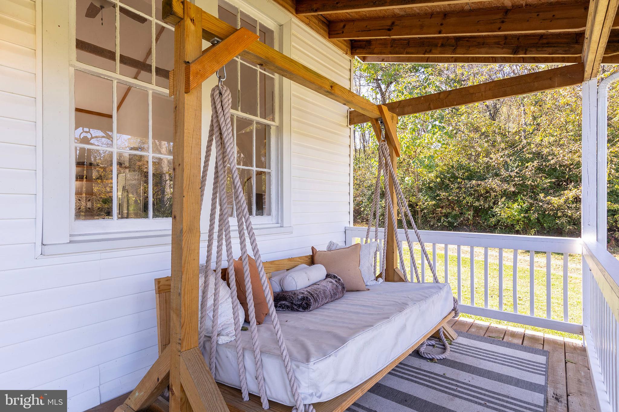 571 Rest Church Road Winchester, VA 22603 - Photo 33 of 45 a view of balcony with two chairs and wooden floor
