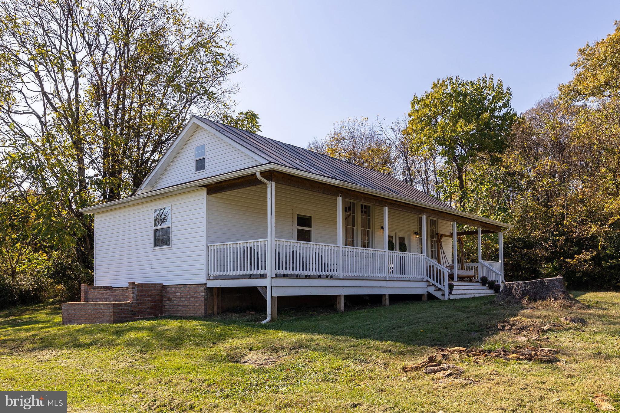 571 Rest Church Road Winchester, VA 22603 - Photo 36 of 45 a view of a house with a yard chairs and swimming pool with a barbeque