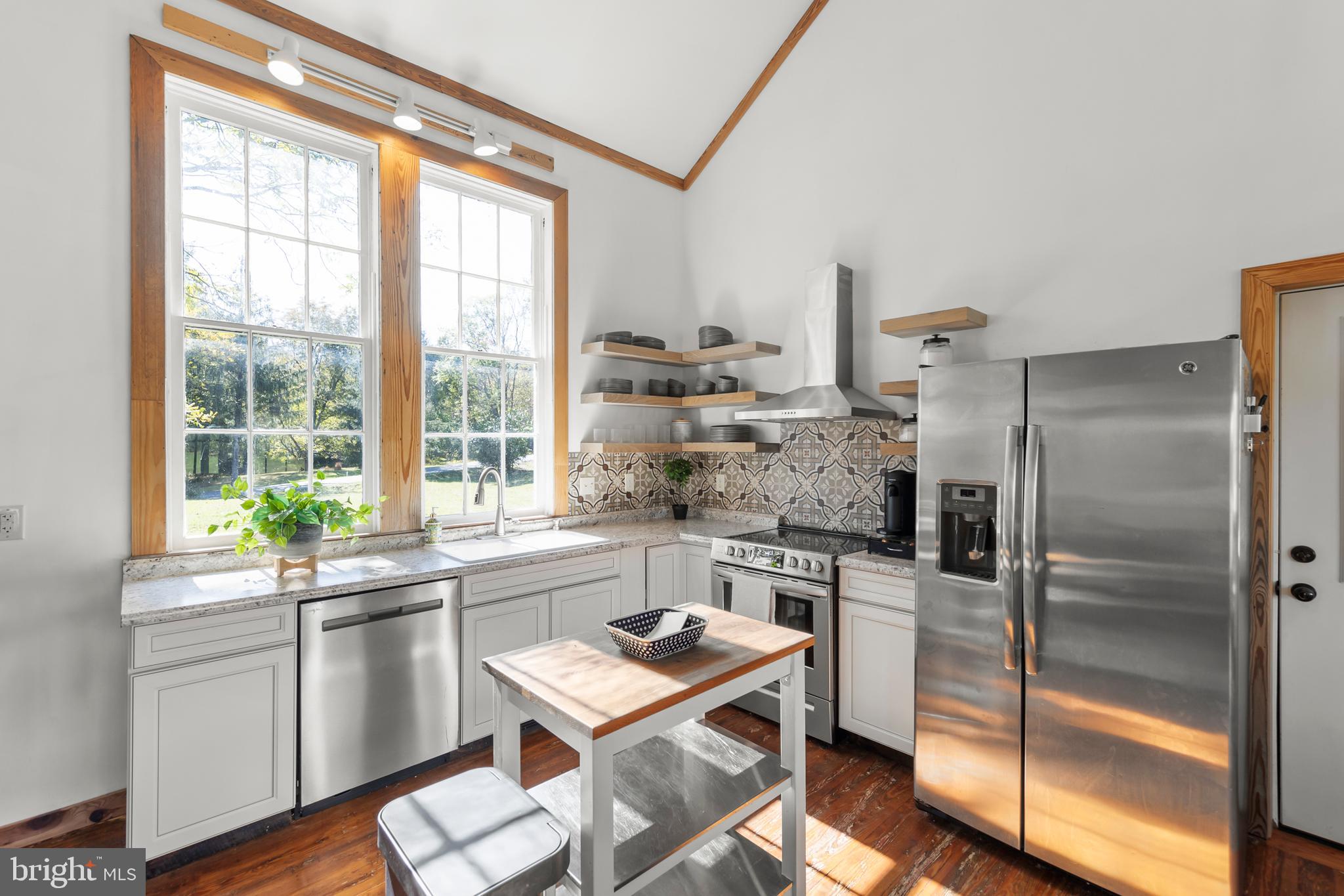 571 Rest Church Road Winchester, VA 22603 - Photo 3 of 45 a kitchen with a sink stove and refrigerator