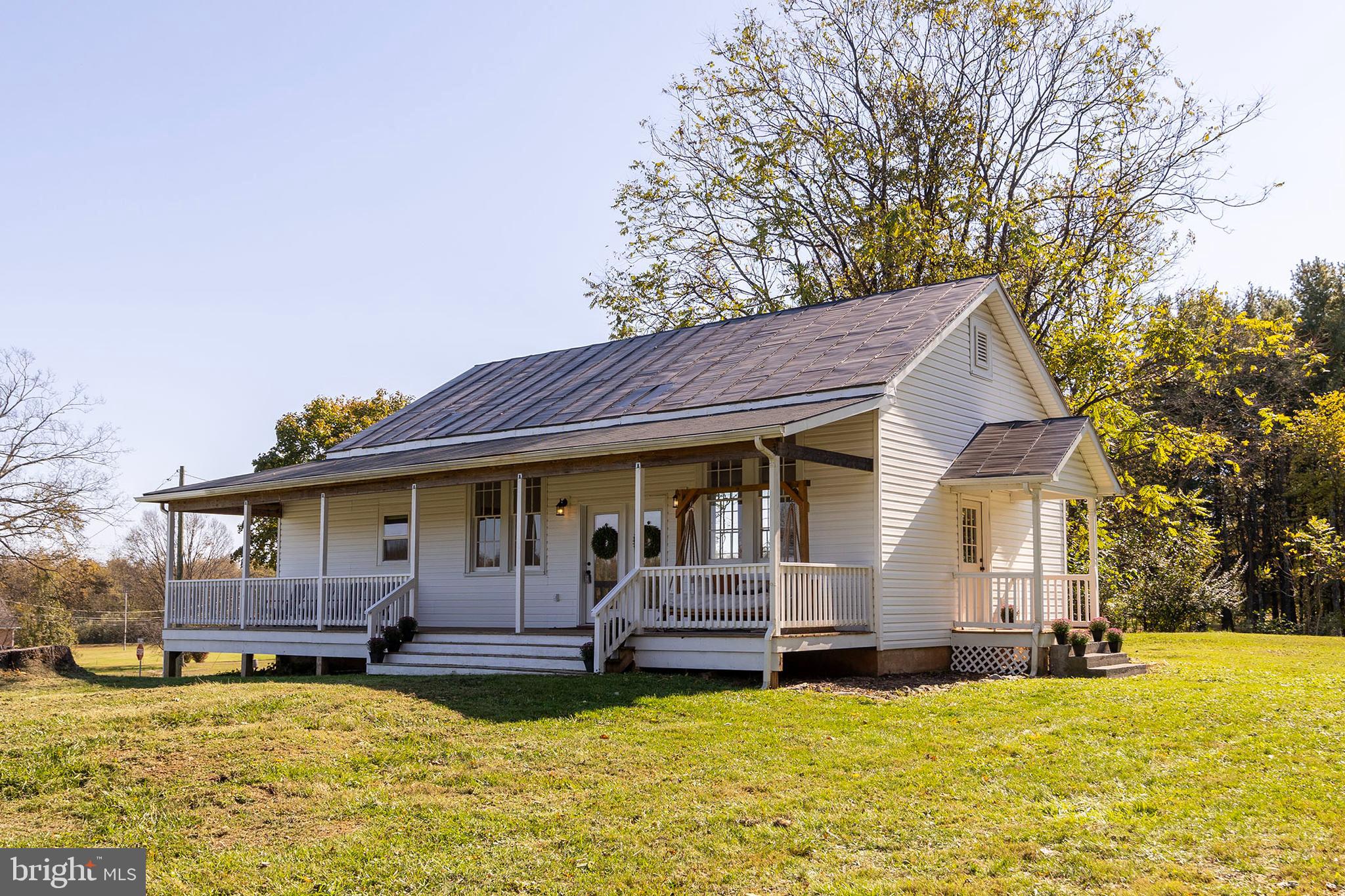 571 Rest Church Road Winchester, VA 22603 - Photo 42 of 45 a view of a house with a big yard and large trees