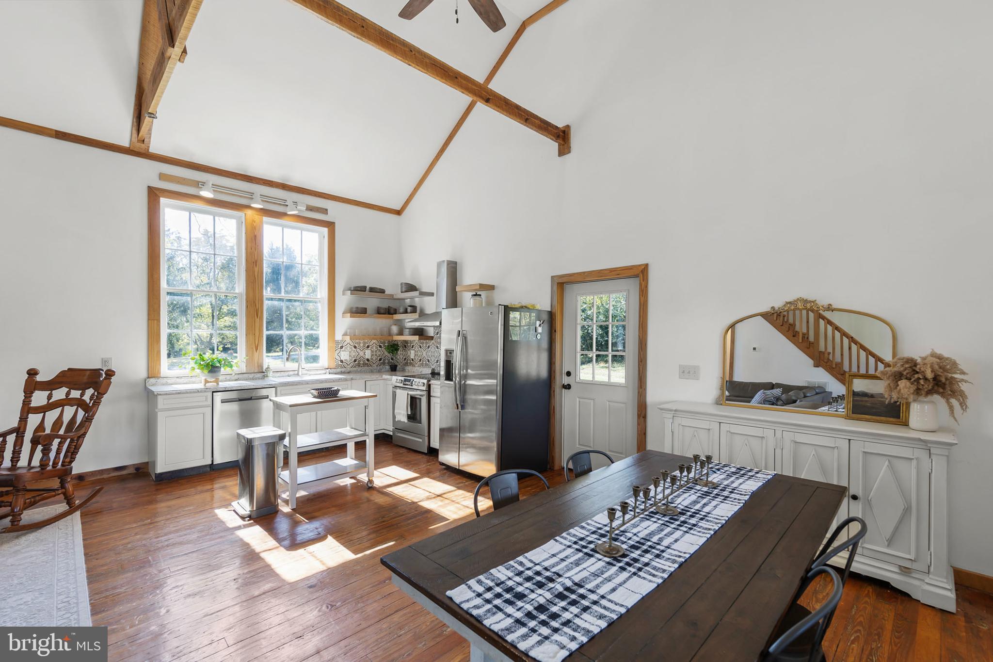 571 Rest Church Road Winchester, VA 22603 - Photo 5 of 45 a view of a workspace with furniture and a window