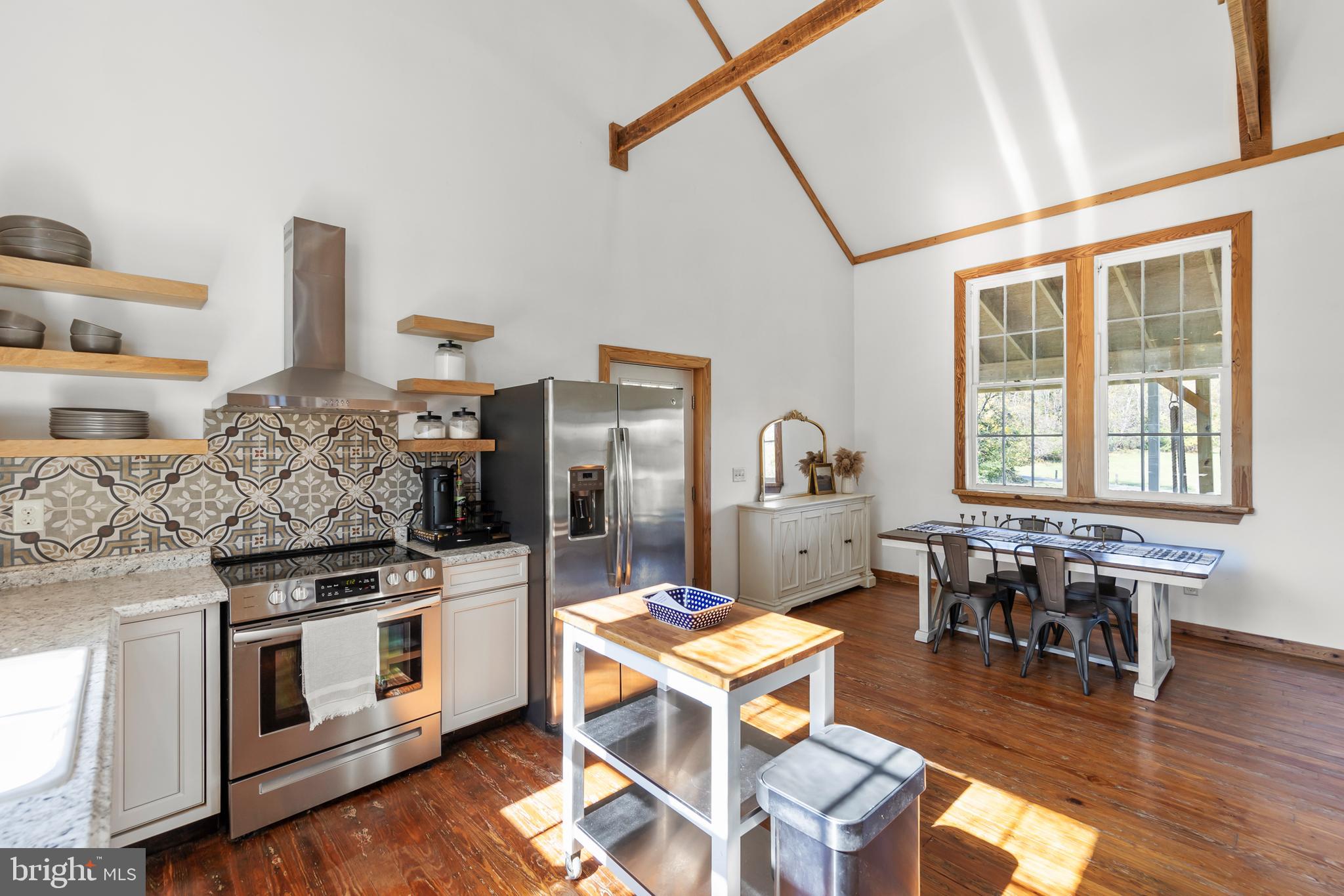 571 Rest Church Road Winchester, VA 22603 - Photo 9 of 45 a kitchen with stainless steel appliances granite countertop a stove and a refrigerator