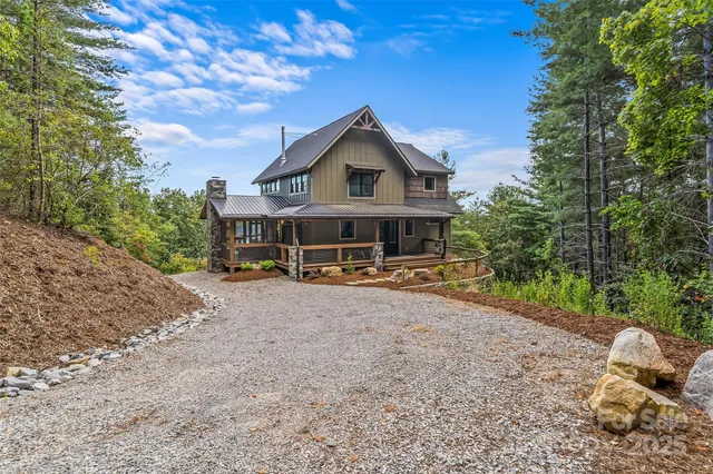 a kitchen with stainless steel appliances granite countertop sink stove top oven and cabinets