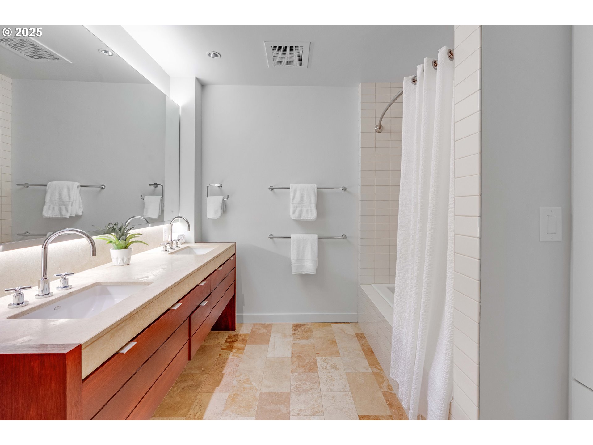 836 South Curry Street, Unit 1206 Portland, OR 97239 - Photo 16 of 41 a bathroom with a sink double vanity and a mirror