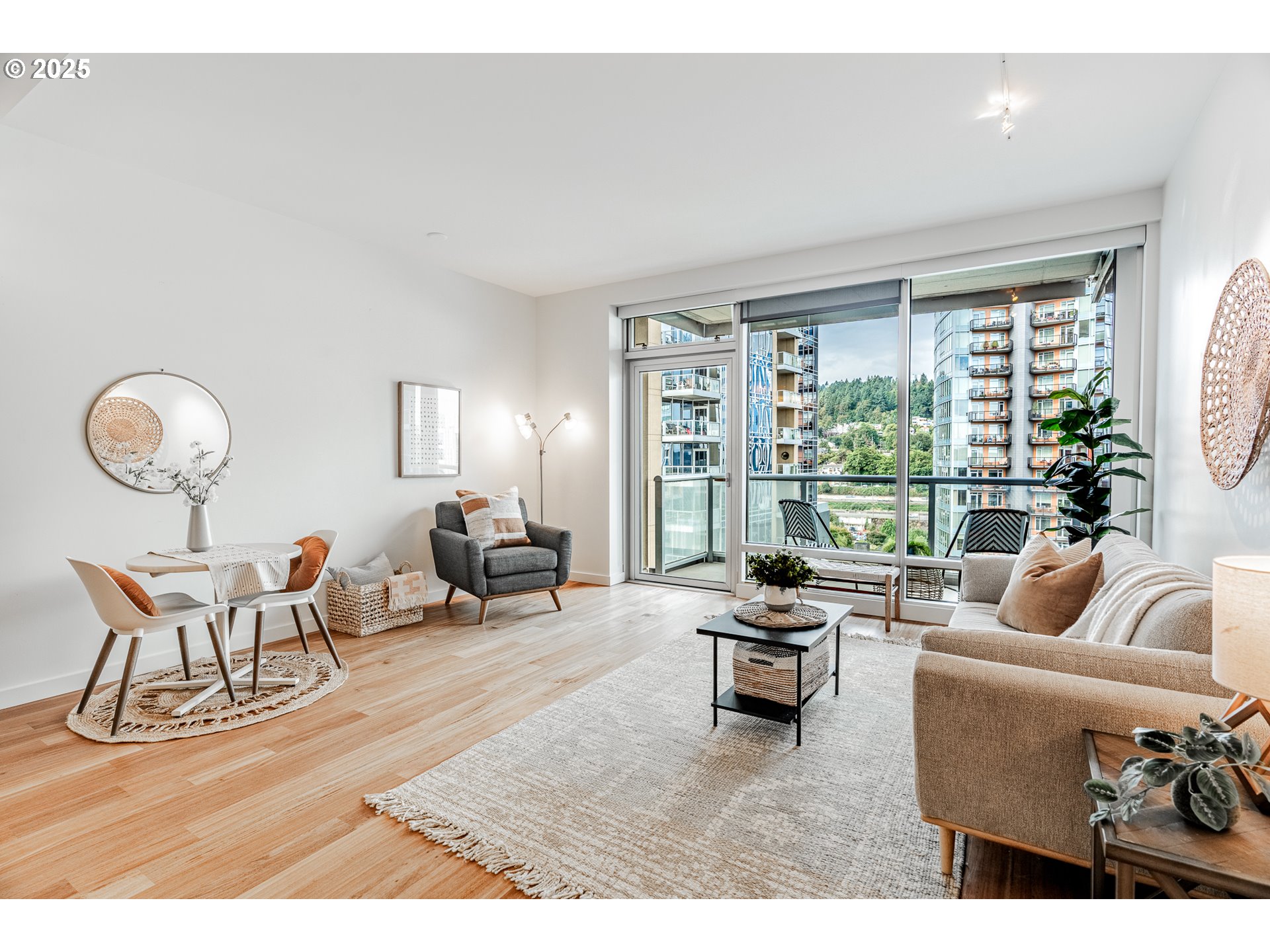 836 South Curry Street, Unit 1206 Portland, OR 97239 - Photo 5 of 41 a living room with furniture and a large window