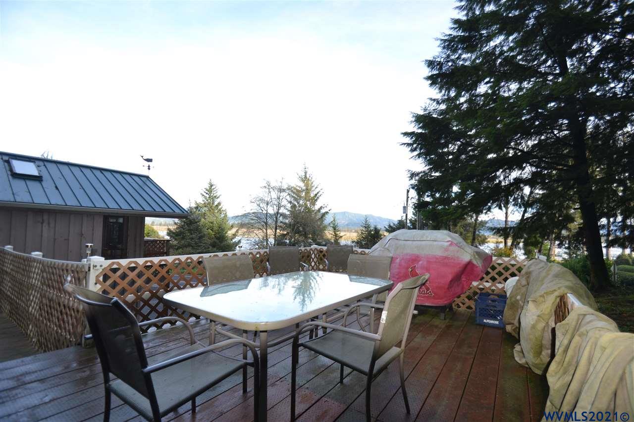 1690 Bayocean Road Northwest Tillamook, OR 97141 - Photo 19 of 25 a view of a table and chairs in patio