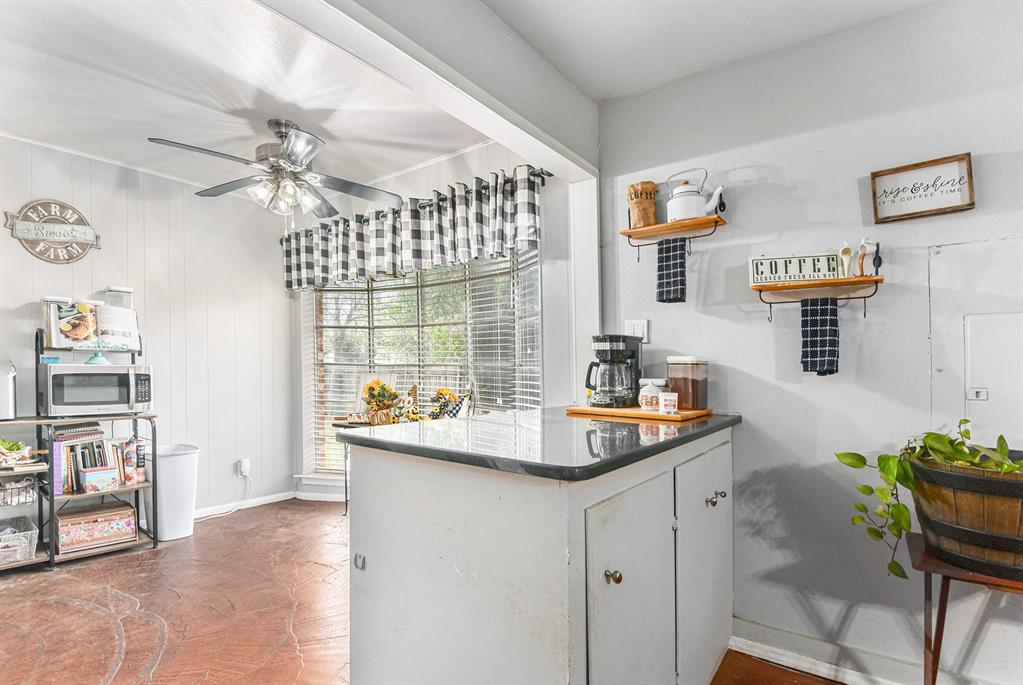 6608 Swanee Court Watauga, TX 76148 - Photo 17 of 30 a room that has a table and a chair in it