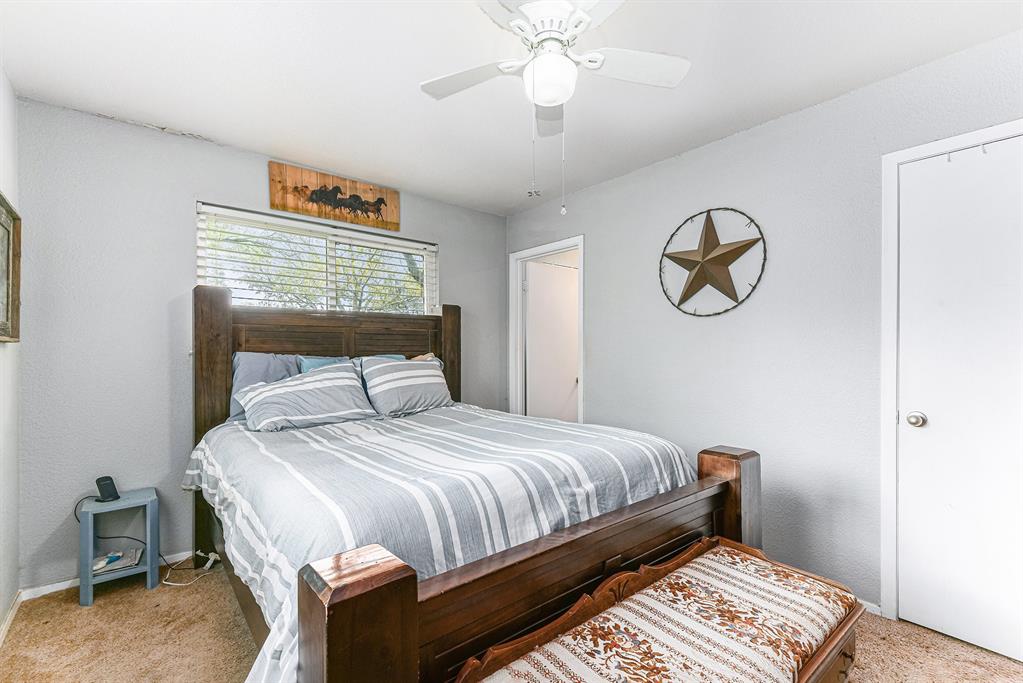 6608 Swanee Court Watauga, TX 76148 - Photo 19 of 30 a bedroom with a bed and a window
