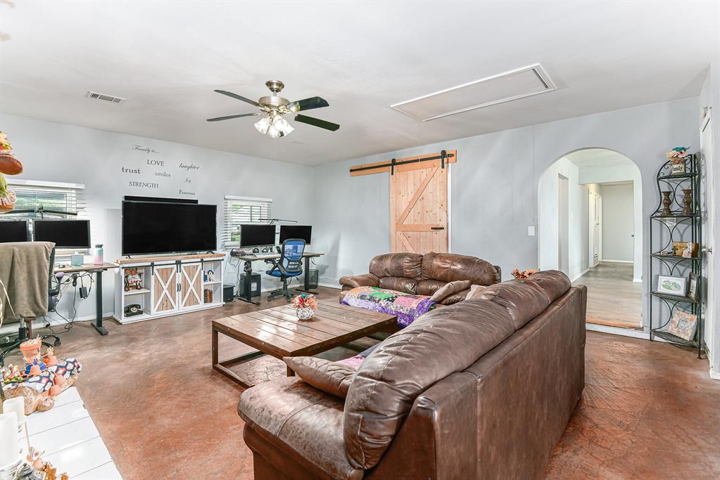 6608 Swanee Court Watauga, TX 76148 - Photo 6 of 30 a living room with furniture and a flat screen tv