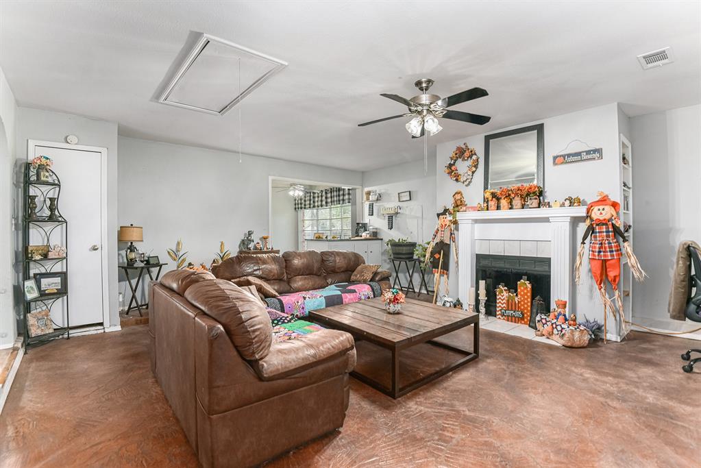 6608 Swanee Court Watauga, TX 76148 - Photo 7 of 30 a living room with furniture and a fireplace