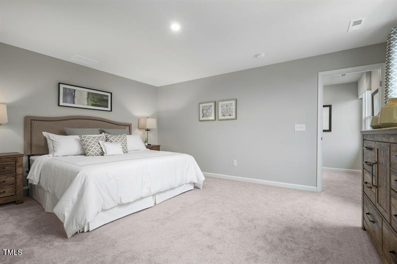 3821 Dragonfly Road Bailey, NC 27807 - Photo 6 of 10 a bedroom with a bed and a view of balcony