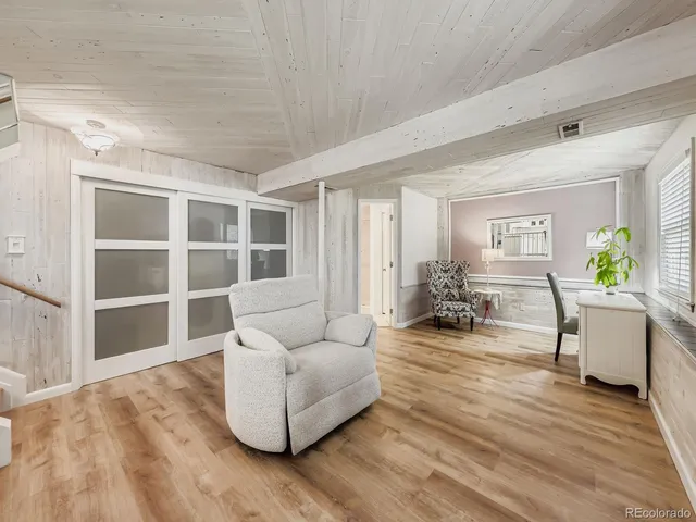 a bedroom with a bed and a table