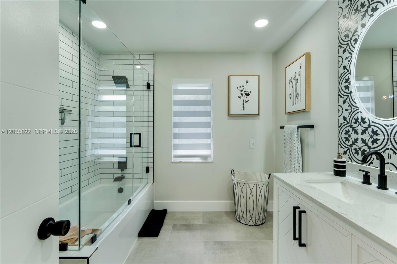 14830 Southwest 149th Street Miami, FL 33196 - Photo 19 of 43 a bathroom with a tub sink and mirror