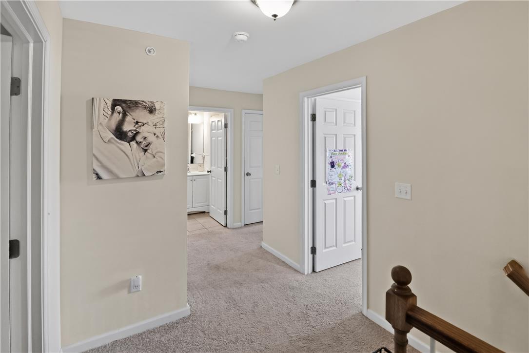 4502 Benjamin Court Emmaus, PA 18049 - Photo 32 of 48 A well-lit landing features soft carpeting and white paneled doors leading to various rooms.