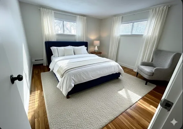 a bedroom with a bed and window