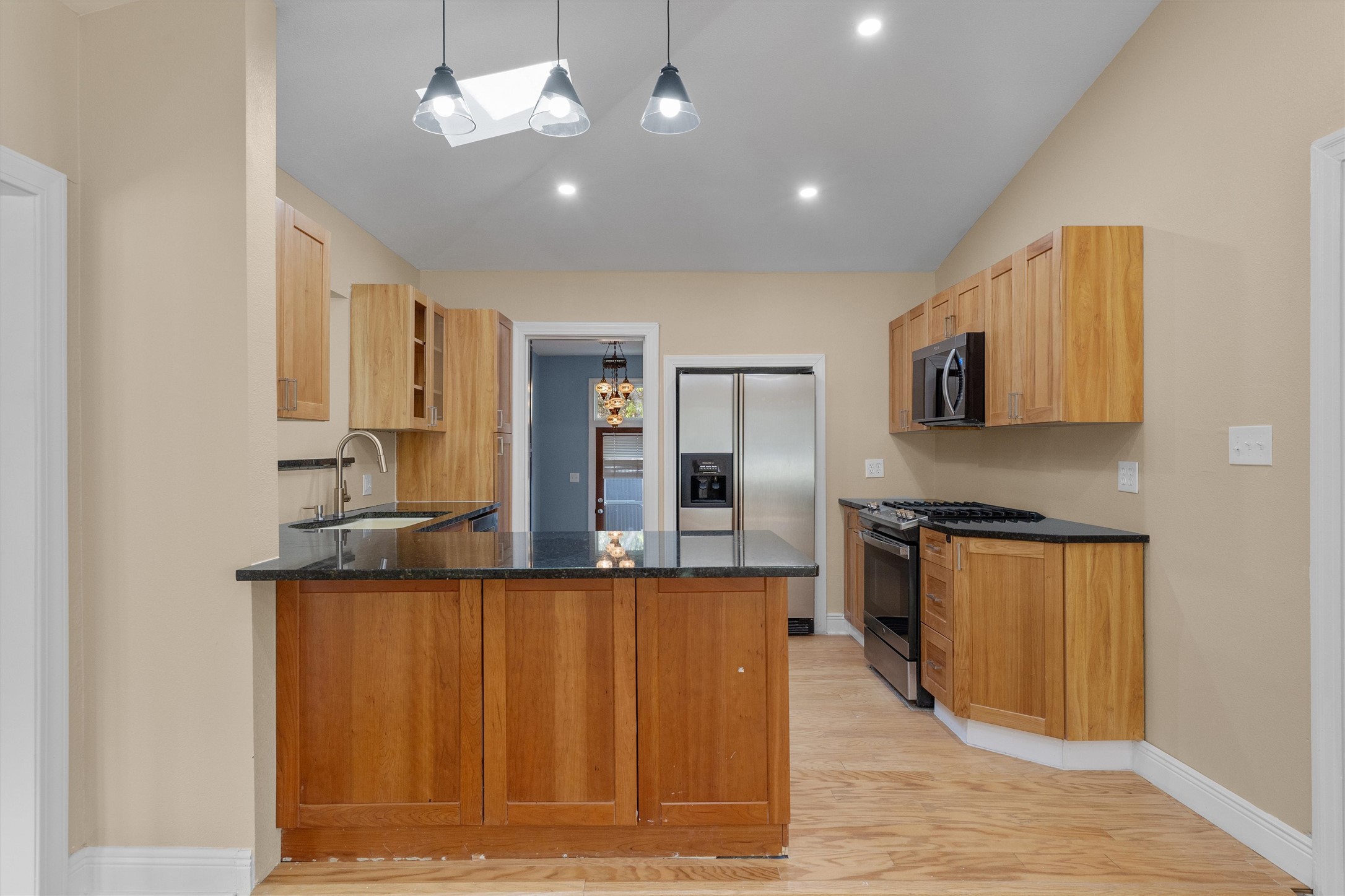 400 East Monroe Street Austin, TX 78704 - Photo 11 of 39 a kitchen with stainless steel appliances granite countertop a refrigerator a stove top oven a sink and dishwasher