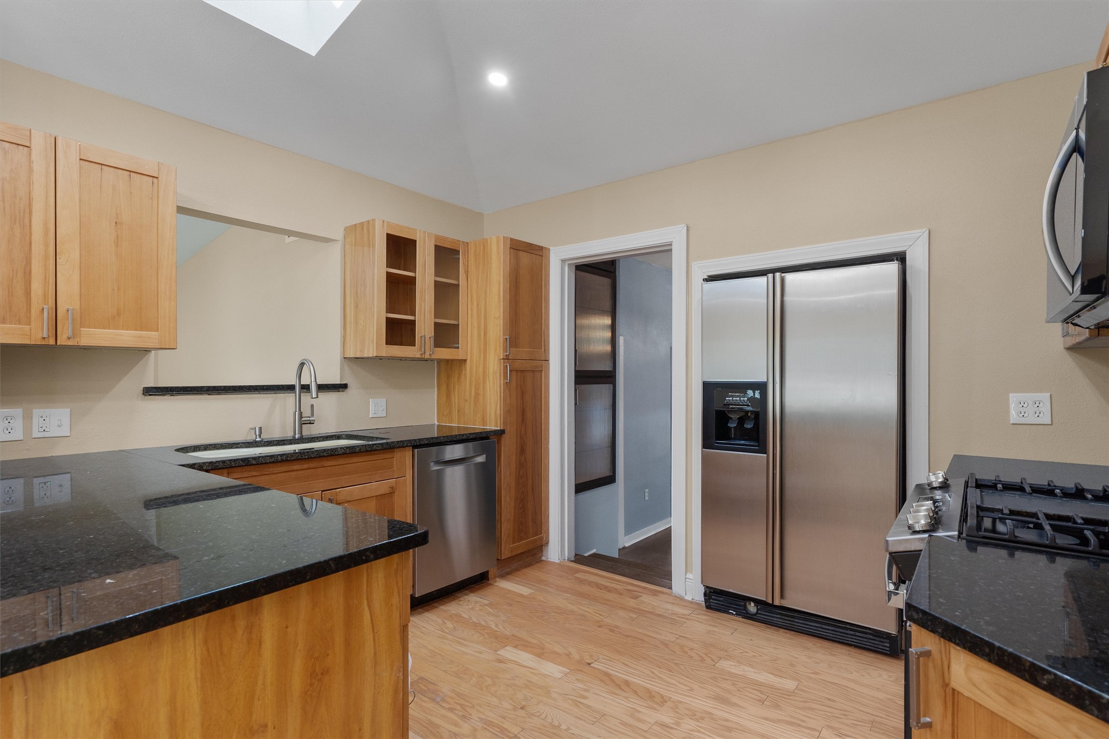 400 East Monroe Street Austin, TX 78704 - Photo 12 of 39 a kitchen with stainless steel appliances granite countertop a refrigerator a sink and a stove
