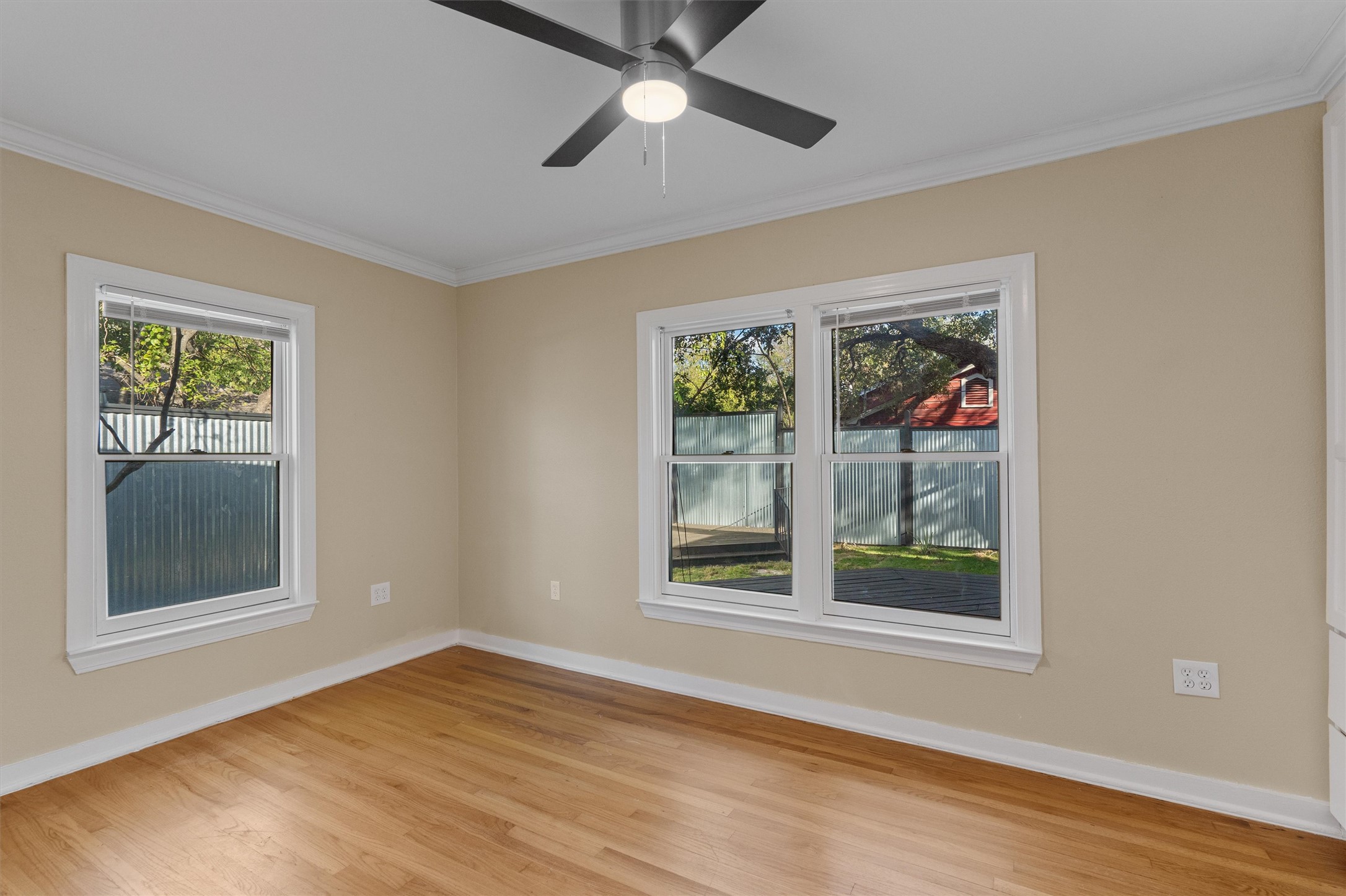 400 East Monroe Street Austin, TX 78704 - Photo 26 of 39 a view of an empty room with a window and wooden floor