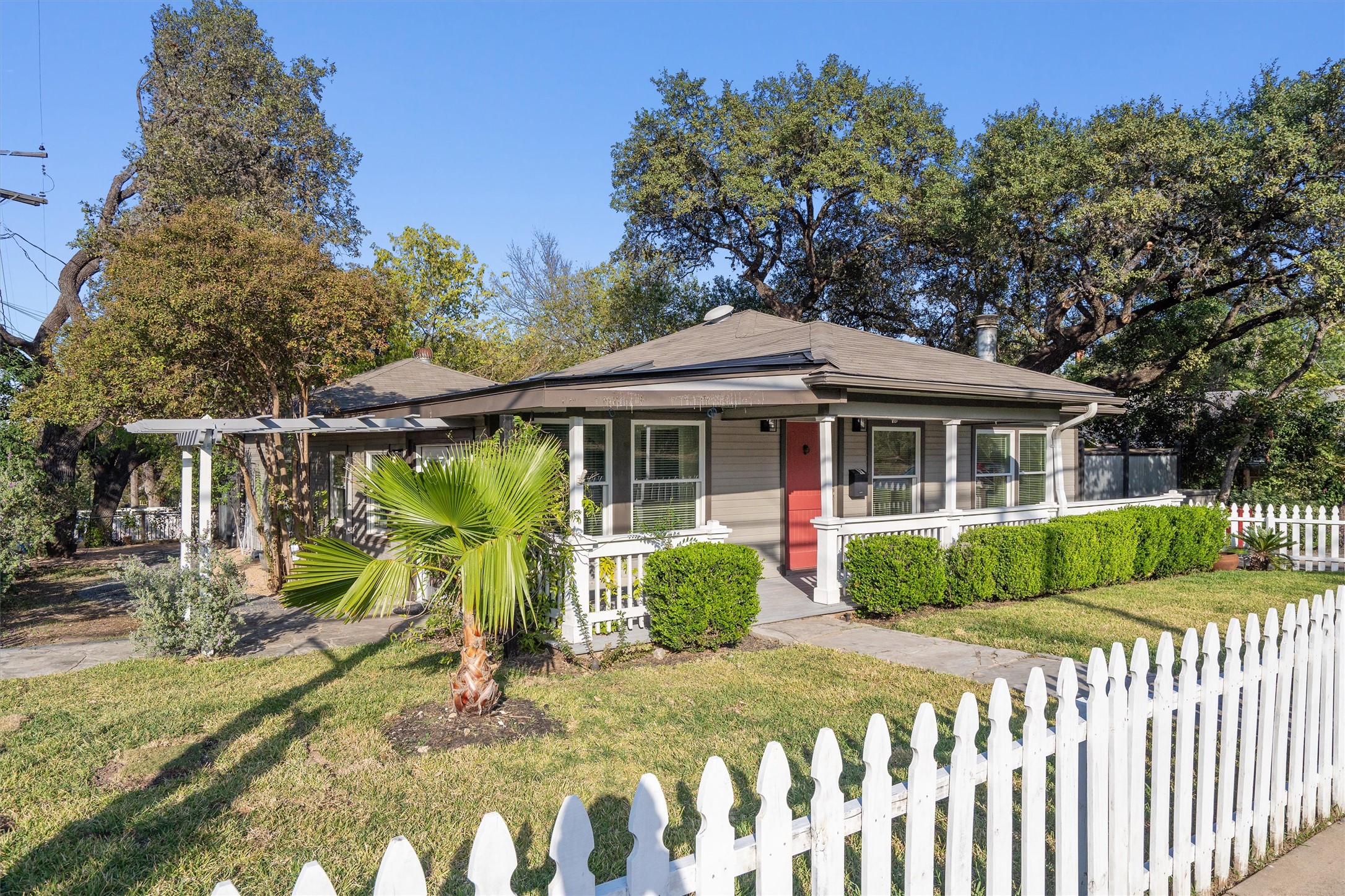 400 East Monroe Street Austin, TX 78704 - Photo 3 of 39 a front view of a house with garden