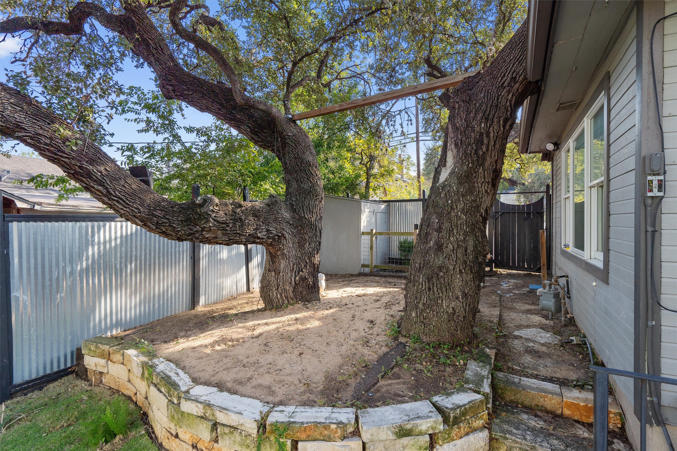 400 East Monroe Street Austin, TX 78704 - Photo 35 of 39 a backyard of a house with table and chairs