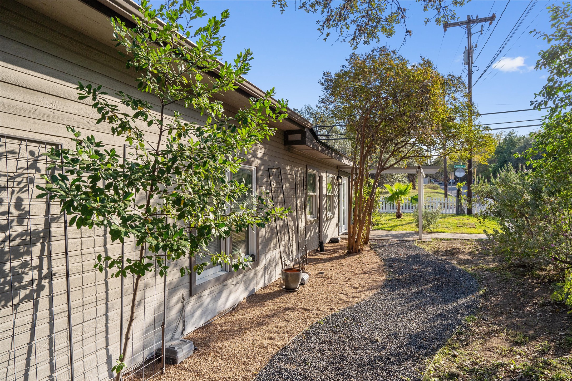 400 East Monroe Street Austin, TX 78704 - Photo 38 of 39 a view of a yard with plants and wooden fence
