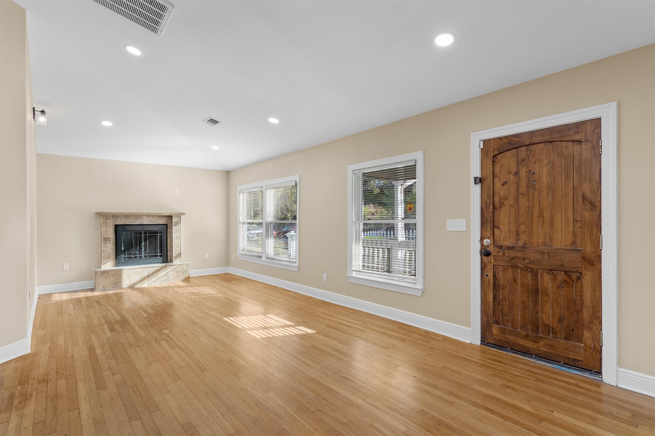 400 East Monroe Street Austin, TX 78704 - Photo 5 of 39 a view of an empty room with window and wooden floor