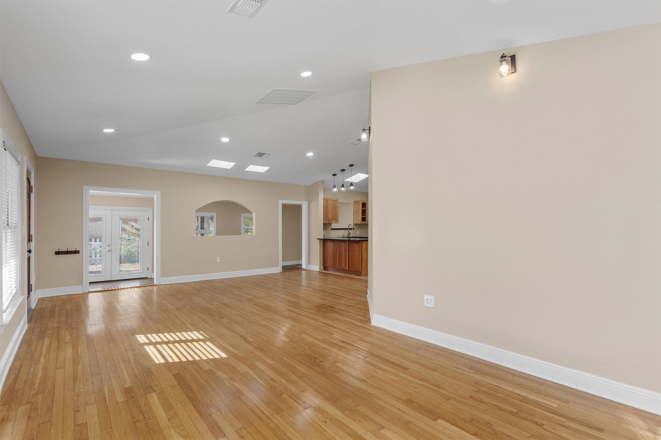 400 East Monroe Street Austin, TX 78704 - Photo 6 of 39 a view of an empty room with wooden floor and a window