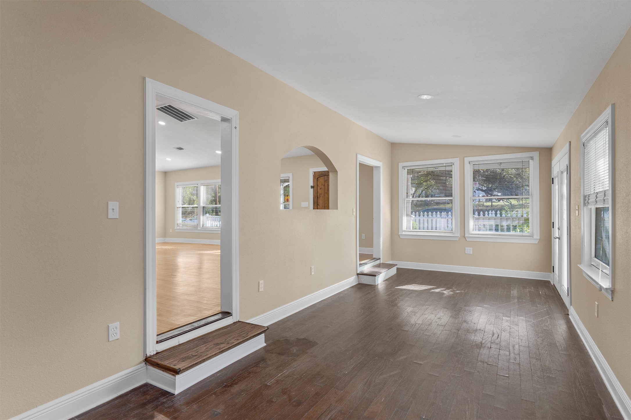 400 East Monroe Street Austin, TX 78704 - Photo 9 of 39 an empty room with wooden floor and windows